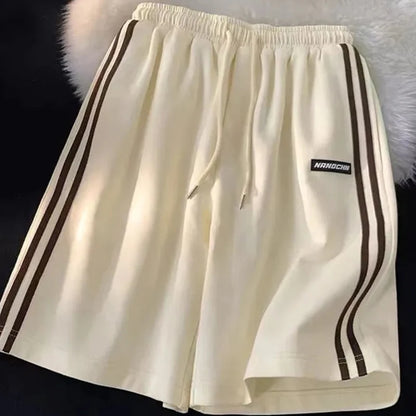 Pantalones cortos a rayas para mujer, ropa de calle de verano, pantalones cortos holgados de pierna ancha, pantalones cortos deportivos coreanos informales con cintura elástica, pantalones cortos de gran tamaño para parejas.