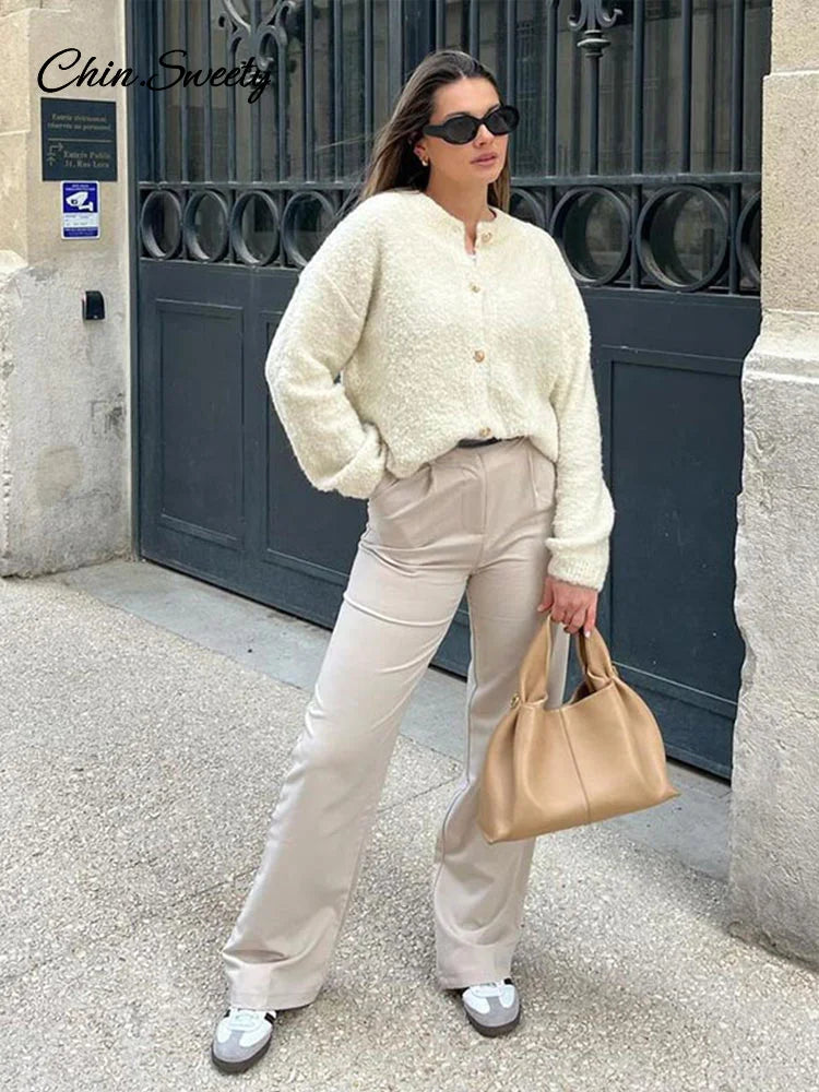 Suéter elegante de manga larga para mujer, cárdigan liso holgado de un solo pecho con cuello redondo, ropa de abrigo suave y a juego para primavera 2025.