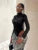 Body de manga larga con cuello alto para mujer, lencería sexy, top negro, mono de una pieza de PU con retazos