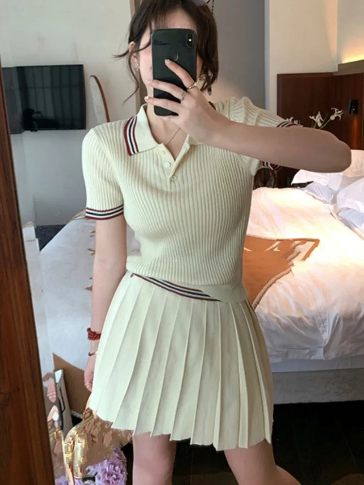 Conjunto de falda de punto de dos piezas para mujer, top de manga corta con cuello vuelto y minifalda plisada, moda coreana, otoño