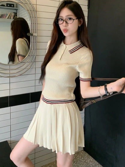 Conjunto de falda de punto de dos piezas para mujer, top de manga corta con cuello vuelto y minifalda plisada, moda coreana, otoño