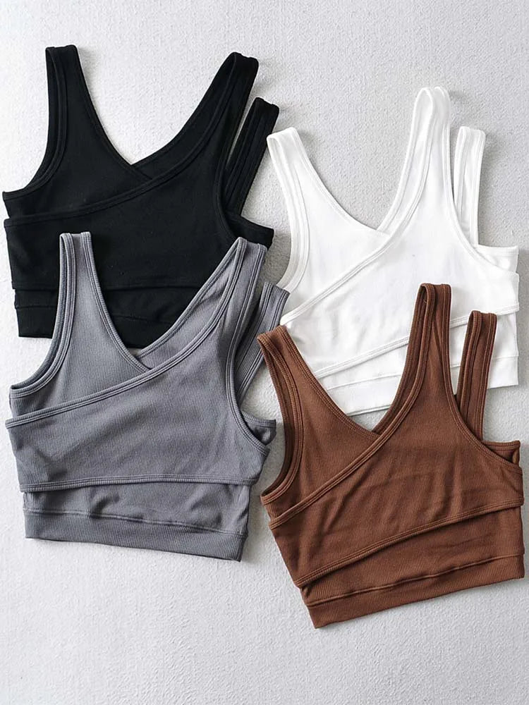 Camisola sexy de punto liso, corta, ahuecada, sin mangas