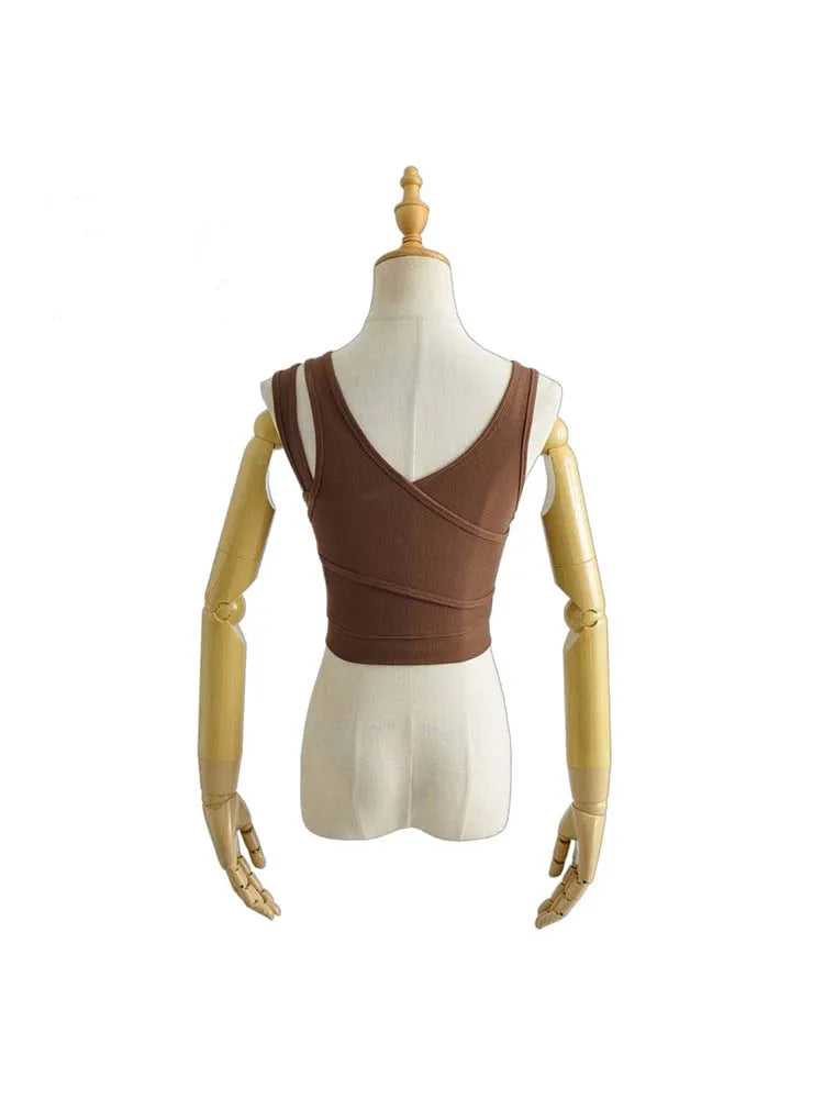 Camisola sexy de punto liso, corta, ahuecada, sin mangas
