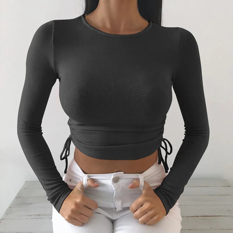 Camiseta sexy de manga larga con cuello redondo y corte ajustado para mujer, otoño 2025, de punto liso con vendaje irregular y cordón ajustable