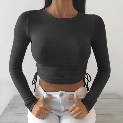 Camiseta sexy de manga larga con cuello redondo y corte ajustado para mujer, otoño 2025, de punto liso con vendaje irregular y cordón ajustable