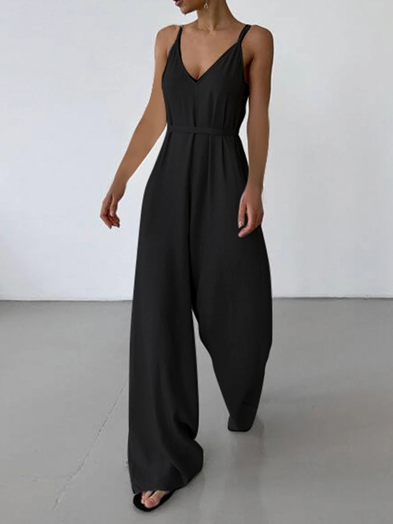 Monos bohemios negros informales holgados con cuello en V sin mangas para mujer, monos de pierna ancha con espalda descubierta y tirantes finos para vacaciones.