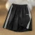 Pantalones cortos a rayas para mujer, ropa de calle de verano, pantalones cortos holgados de pierna ancha, pantalones cortos deportivos coreanos informales con cintura elástica, pantalones cortos de gran tamaño para parejas.