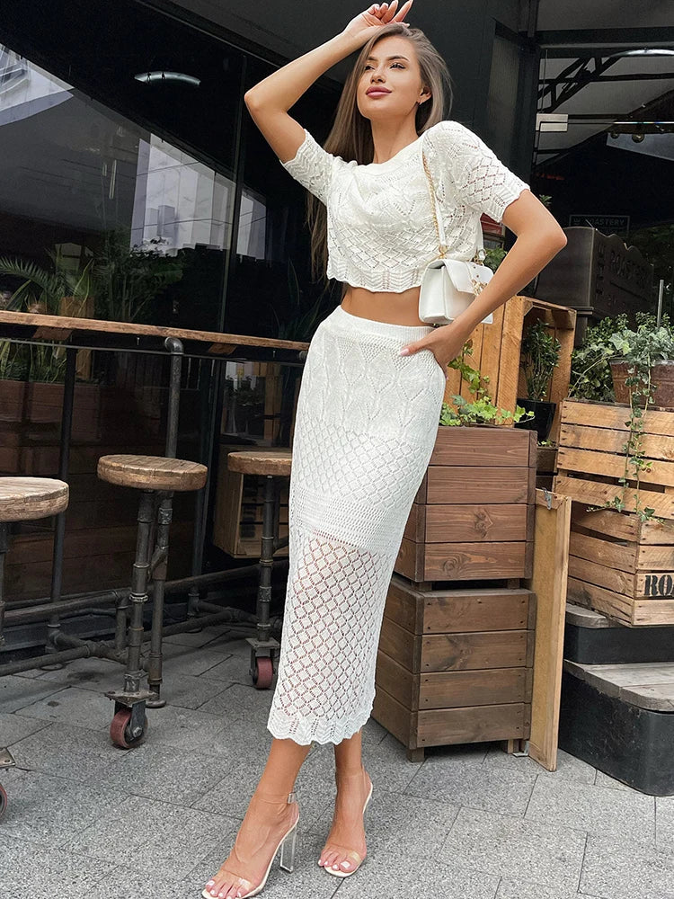 Conjunto de camiseta y falda de punto blanco de manga corta con aberturas transparentes de cintura alta, sexy, ajustado, cruzado en la cadera, conjuntos de dos piezas para mujer