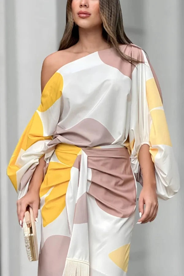 Conjunto de top holgado con mangas globo y falda con flecos con estampado único