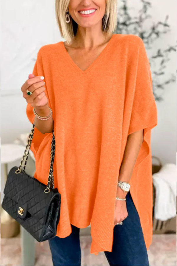 Suéter tipo poncho holgado de color liso con cuello en V
