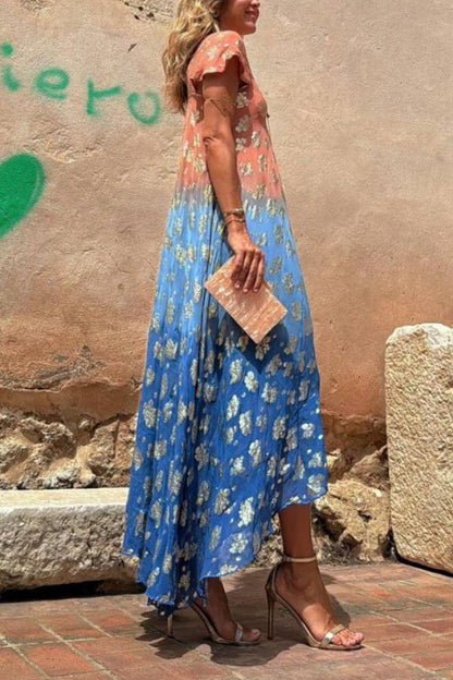 Vestido largo Evaluna con estampado de flores doradas en degradado tie-dye y manga corta