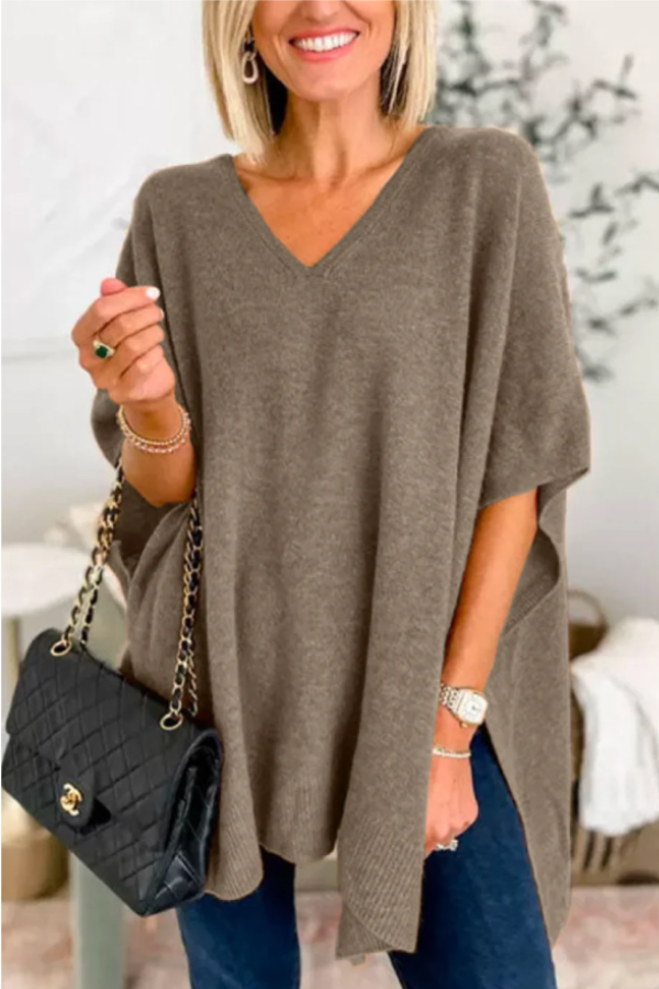 Suéter tipo poncho holgado de color liso con cuello en V