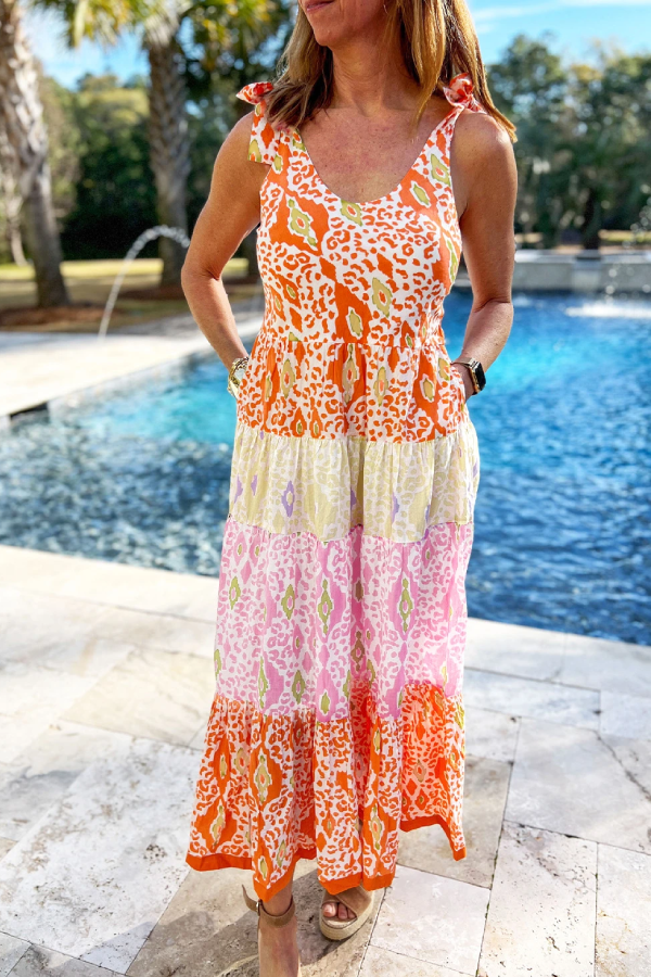 Vestido escalonado con bloques de color de leopardo y tirantes anudados en naranja