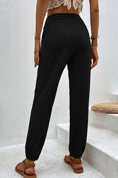 Pantalones casuales de cintura alta con bolsillos sueltos y temperamento