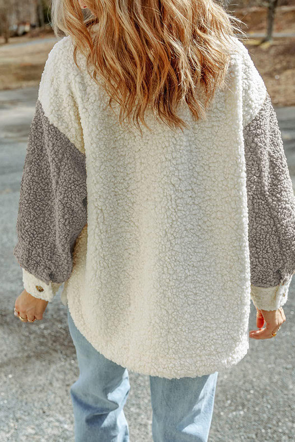 Abrigo de piel holgado con bloques de color y doble bolsillo de manga larga para otoño e invierno