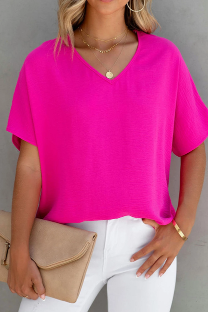 Blusa de manga corta con cuello en V y color liso