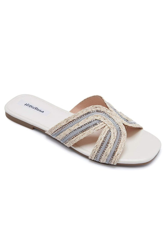 Pantuflas tipo mule de paja tejida con adornos Cara 