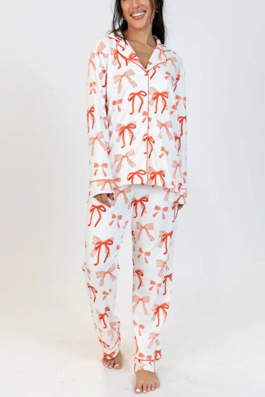 Conjunto de camisa de manga larga con estampado de lazo navideño y pantalón con bolsillo en la cintura elástica