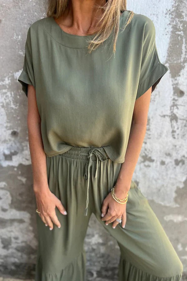 Conjunto de top casual de manga corta con cuello redondo y cintura elástica con bolsillo para atar y pantalones anchos de color liso