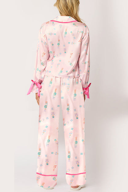 Conjunto de top de terciopelo con estampado navideño, manga larga, bolsillos y pantalones anchos con cintura elástica.