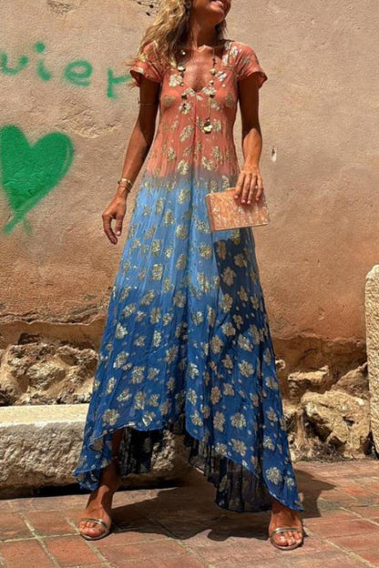 Vestido largo Evaluna con estampado de flores doradas en degradado tie-dye y manga corta