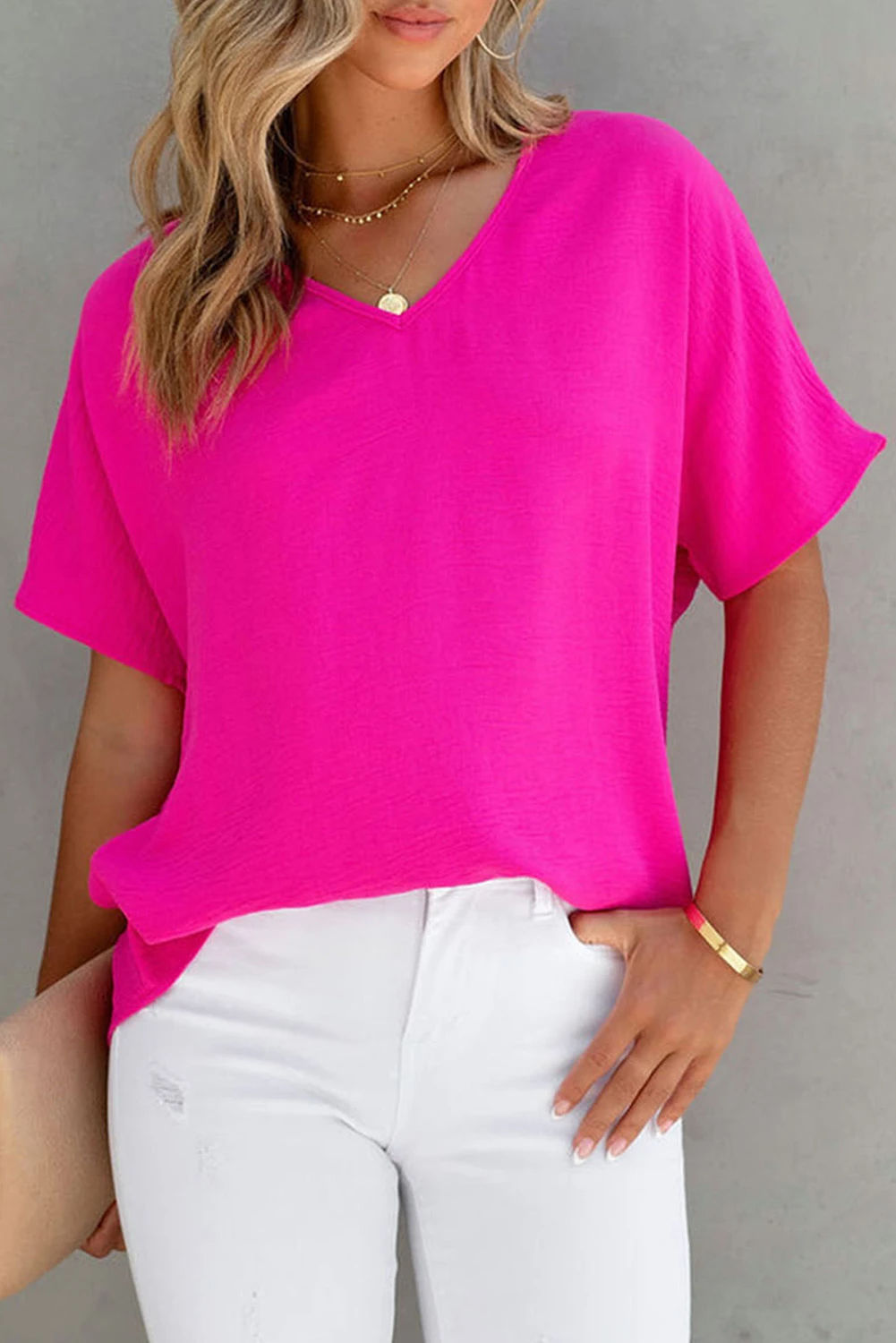 Blusa de manga corta con cuello en V y color liso