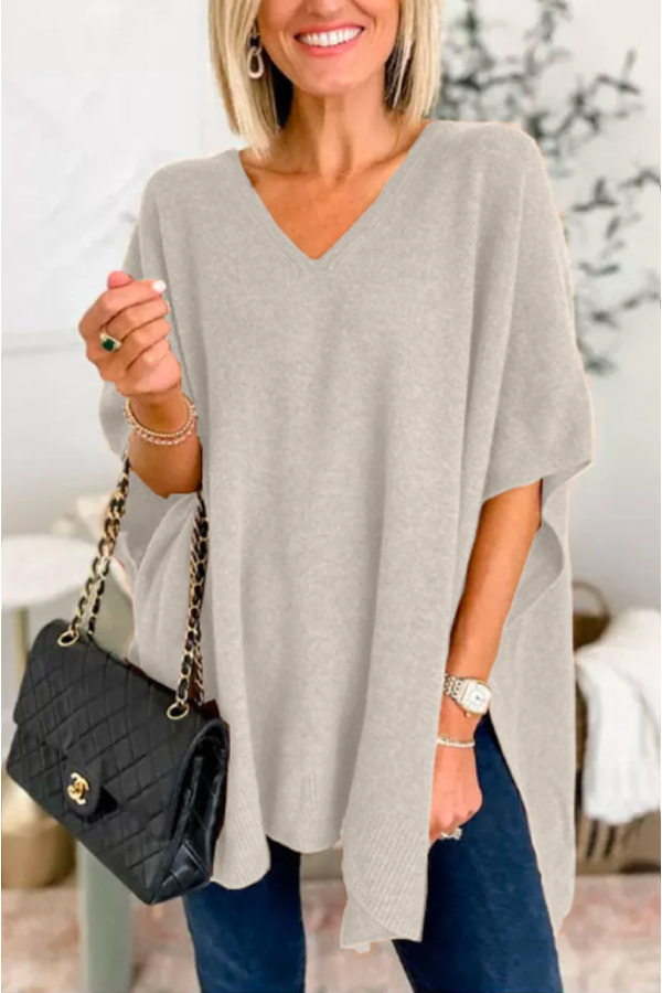 Suéter tipo poncho holgado de color liso con cuello en V