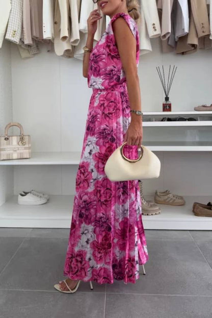 Conjunto de top de cuello redondo con hombreras y pantalones anchos plisados con cintura elástica.