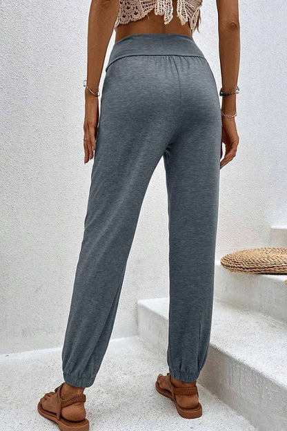 Pantalones casuales de cintura alta con bolsillos sueltos y temperamento