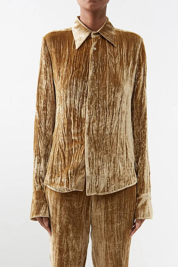 Blusa lisa de manga larga con cuello vuelto y textura elegante