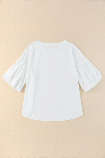 Blusa informal de color blanco liso con mangas abullonadas