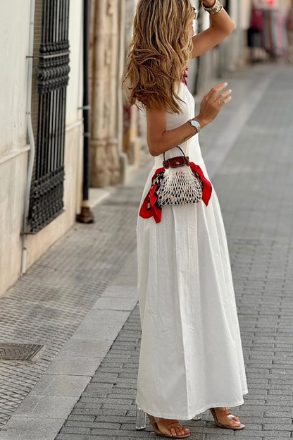 Vestido largo blanco con cintura suelta, cuello redondo, sin mangas y dobladillo