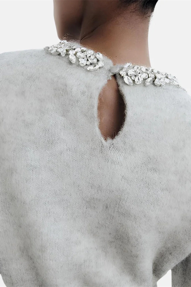Jersey de punto con cuello redondo y adornos de cristales 