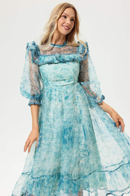 Vestido midi con volantes, mangas farol y cuello redondo estampado 