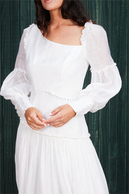 Vestido midi calado con cuello diagonal y mangas farol 