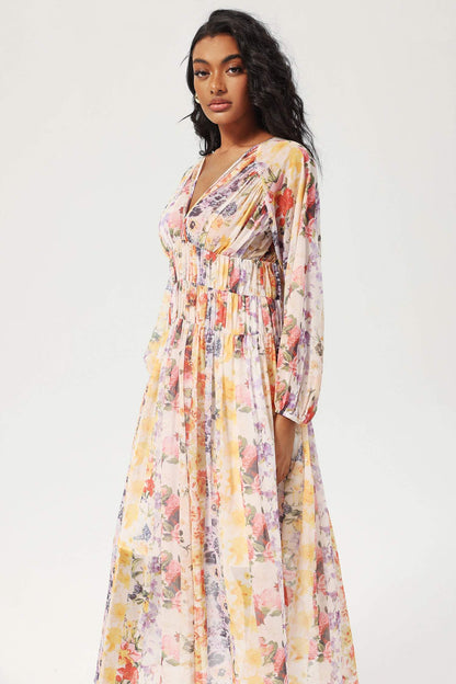 Vestido midi floral con cuello en V y mangas farol 