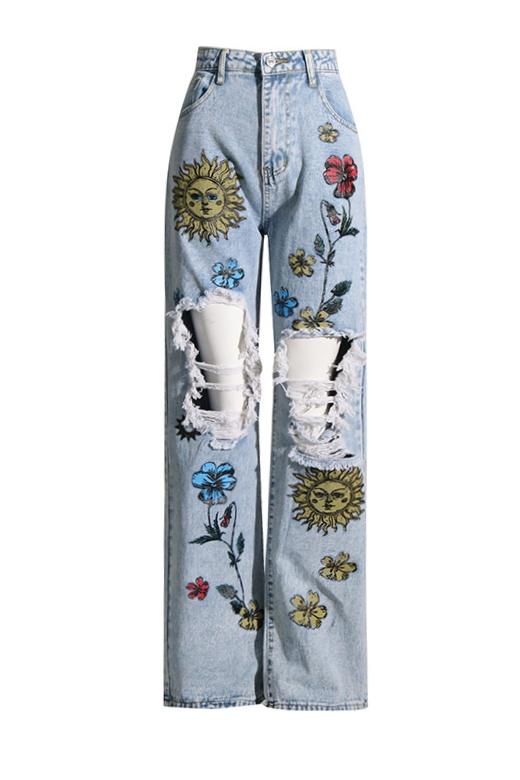 Vaqueros rotos con estampado floral y de sol de Liza 