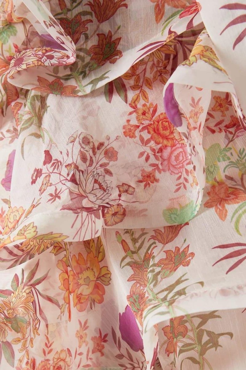 Vestido mini con volantes y estampado floral de Monica 