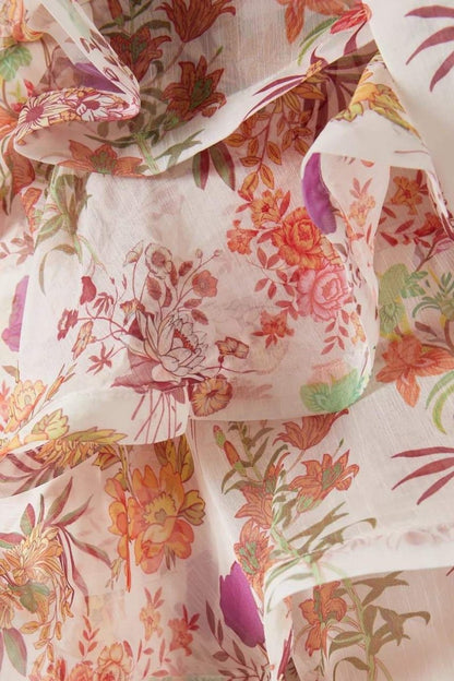 Vestido mini con volantes y estampado floral de Monica 