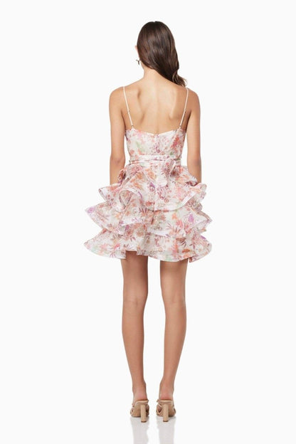 Vestido mini con volantes y estampado floral de Monica 