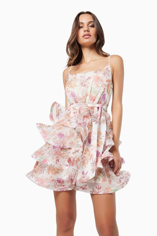 Vestido mini con volantes y estampado floral de Monica 