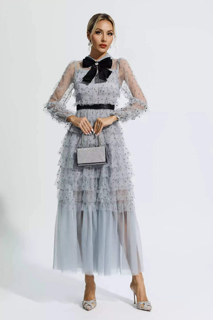 Vestido midi de manga larga con cuello camisero y lazo con volantes 